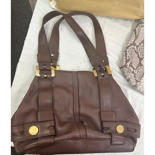 189 - Two authentic Micheal Kors Brown ladies hand bags