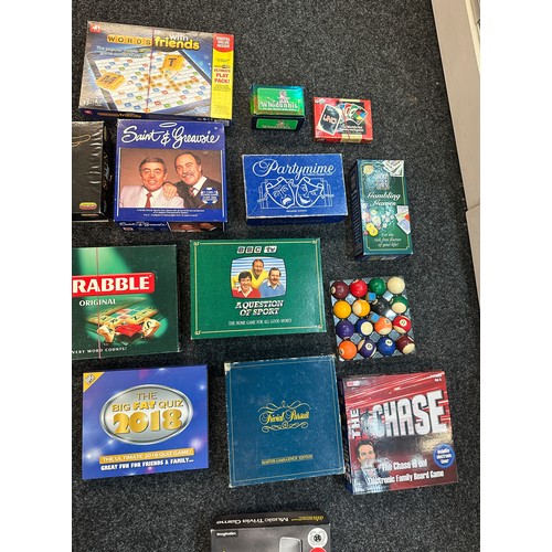 330 - Large selection of vintage and later games to include Trivial pursuit, scrabble, uno, The Chase and ... 