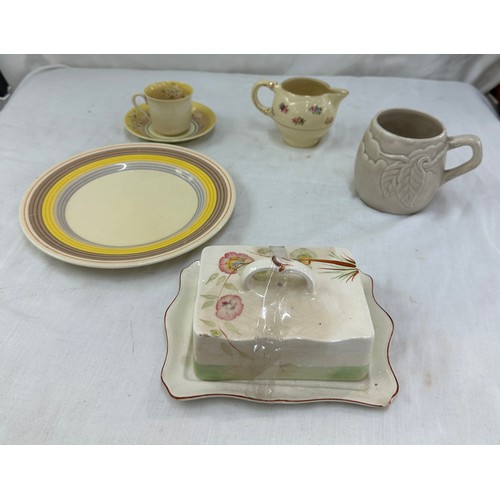 88 - Selection of Clarice Cliff items to include a matching cup and saucer, milk jug, plate etc and a Roy... 