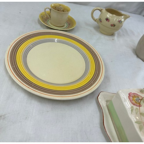 88 - Selection of Clarice Cliff items to include a matching cup and saucer, milk jug, plate etc and a Roy... 