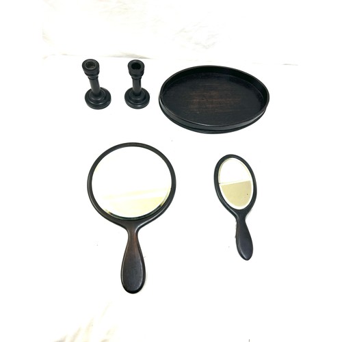 106 - Part Ebony dressing table set includes mirrors, candle sticks etc