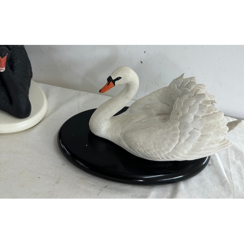 150 - Two swans on stands from The Franklin Mint collection to include 'The 1987 Franklin Mint The Black A... 