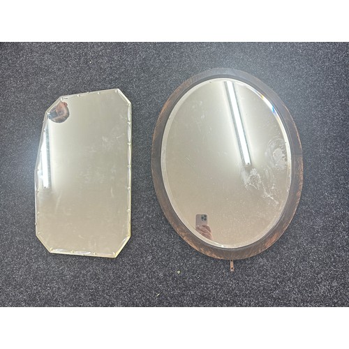 256 - Two vintage mirrors one oval largest measures approx 26 inches tall by 20 inches wide