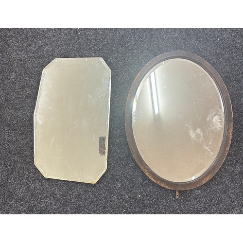 256 - Two vintage mirrors one oval largest measures approx 26 inches tall by 20 inches wide