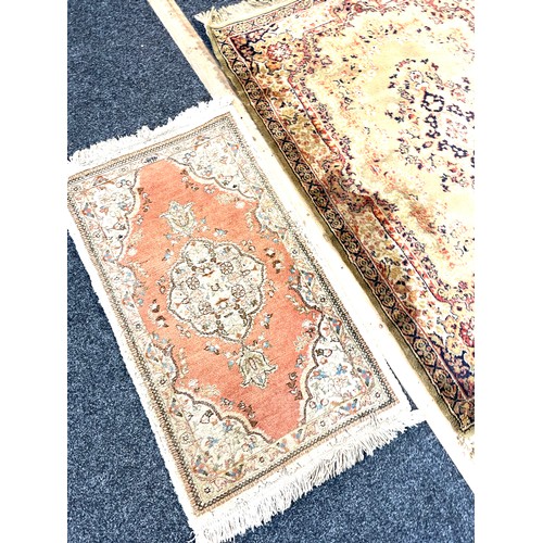 404 - 2 Lounge rugs includes persian rug largest measures 64 inches long 47 inches wide