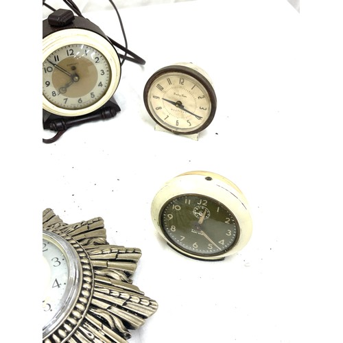 424 - Selection of vintage and later clocks includes Smiths, Baby ben etc