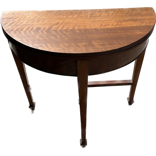 388 - Mahogany half moon card table measures approx 32 inches wide and 22 inches tall