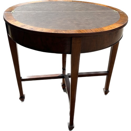 388 - Mahogany half moon card table measures approx 32 inches wide and 22 inches tall