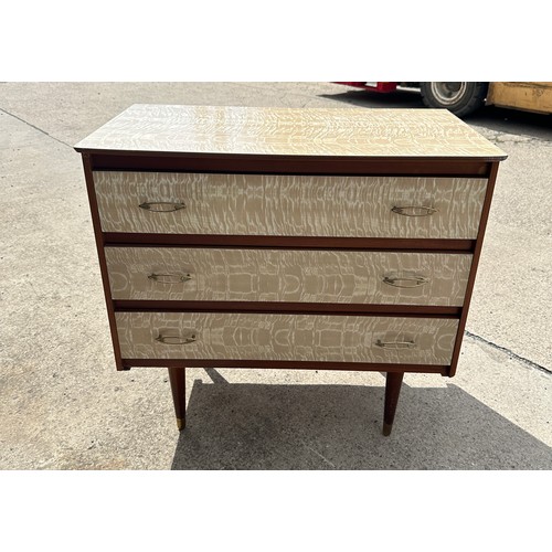 394 - 60's melamine  three drawer chest of drawers measures approx 30 inches wide by 28 inches tall