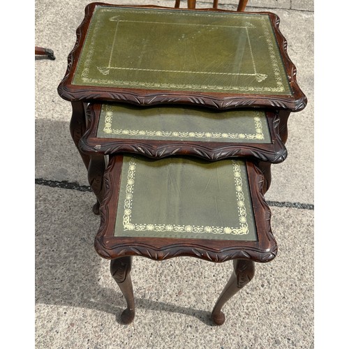 379 - Mahogany nest of three tables with glass top measures approx 20 inches wide by 21 inches tall