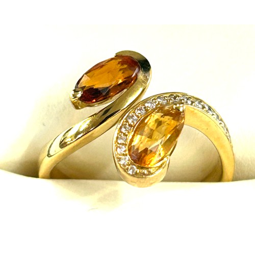 62 - Ladies 18ct gold diamond and citrine dress ring, set with 19 small brilliant cut diamonds, total wei... 