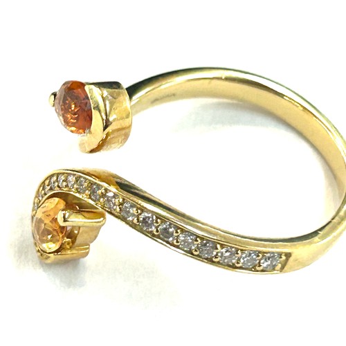 62 - Ladies 18ct gold diamond and citrine dress ring, set with 19 small brilliant cut diamonds, total wei... 