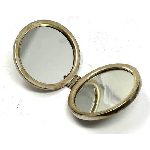 34 - hallmarked silver mirror compact measures approx 7cm dia