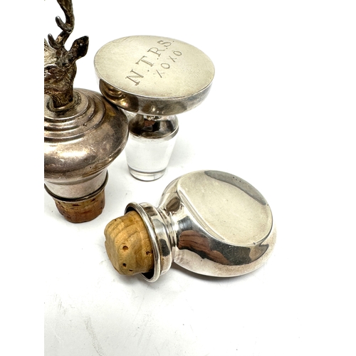 28 - 3 Vintage silver bottle stoppers