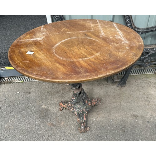 100G - Cast iron base pub table 31.5 inches diameter 27 inches tall