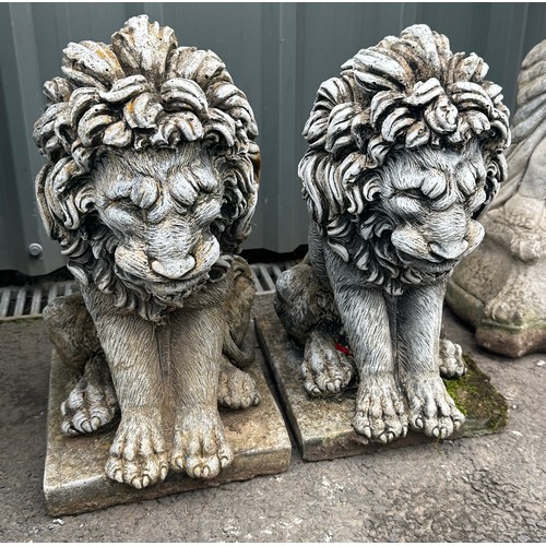 100T - Pair of concrete lion statues 18 inches tall 10 inches wide