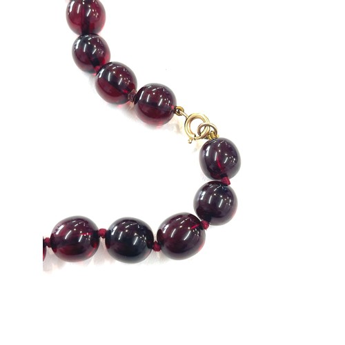 500 - Cherry amber bakelite beads with a gold coloured clasp