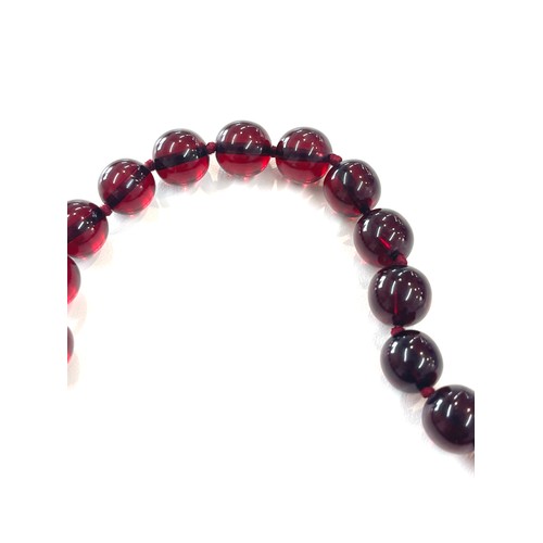 500 - Cherry amber bakelite beads with a gold coloured clasp