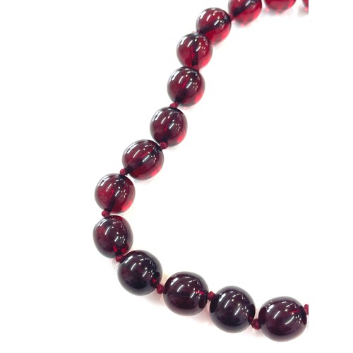 500 - Cherry amber bakelite beads with a gold coloured clasp