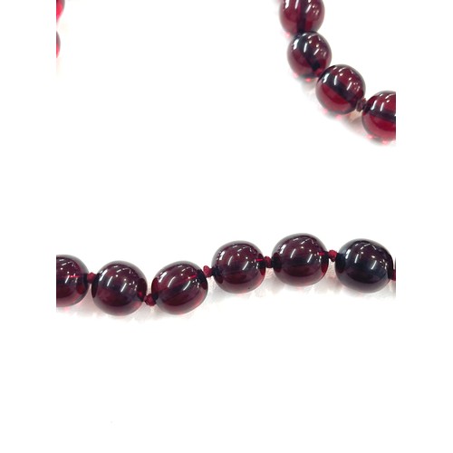 500 - Cherry amber bakelite beads with a gold coloured clasp