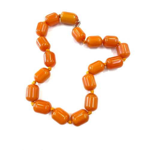 505 - Faux Egg yolk butter scotch necklace with silver clasp, beads have internal streaking, total weight ... 