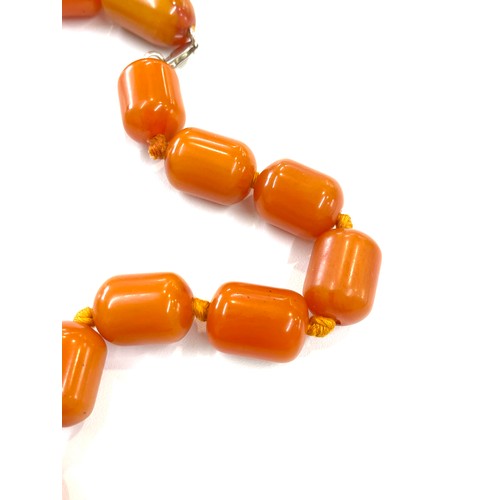 505 - Faux Egg yolk butter scotch necklace with silver clasp, beads have internal streaking, total weight ... 