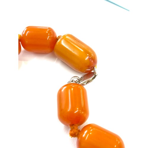 505 - Faux Egg yolk butter scotch necklace with silver clasp, beads have internal streaking, total weight ... 