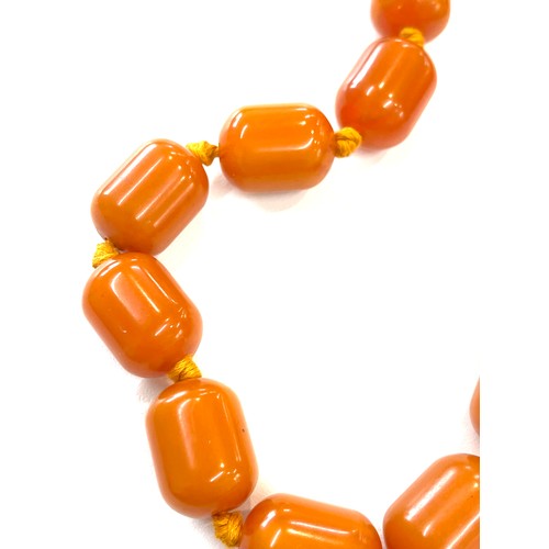 505 - Faux Egg yolk butter scotch necklace with silver clasp, beads have internal streaking, total weight ... 