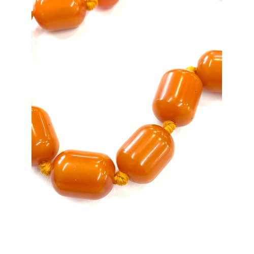 505 - Faux Egg yolk butter scotch necklace with silver clasp, beads have internal streaking, total weight ... 