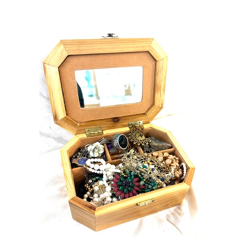 455 - Selection of costume jewellery to include necklaces, rings etc in a wooden embroidered jewellery box