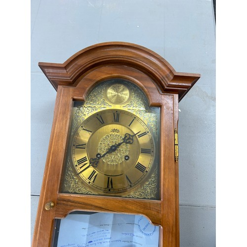 10 - Brass based 2 Key hole wall hanging clock 32 inches long 13 inches wide, untested