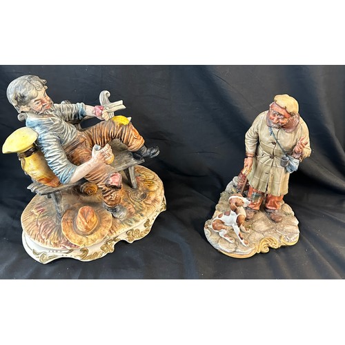 573 - Two Capodimonte porcelain figures one man and his dog and one other largest measures approx 11 inche... 