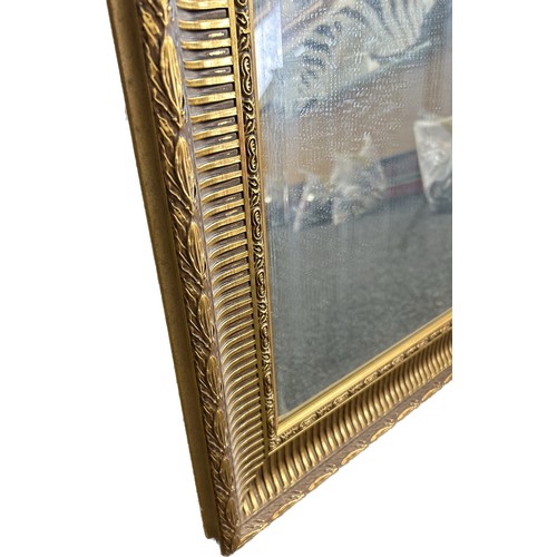 259 - Large gilt framed mirror measures approx 35 inches  by 26 inches