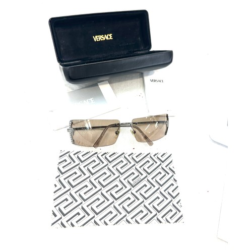 481 - Pair of boxed ladies Versace sunglasses and a DKNY wrist watch