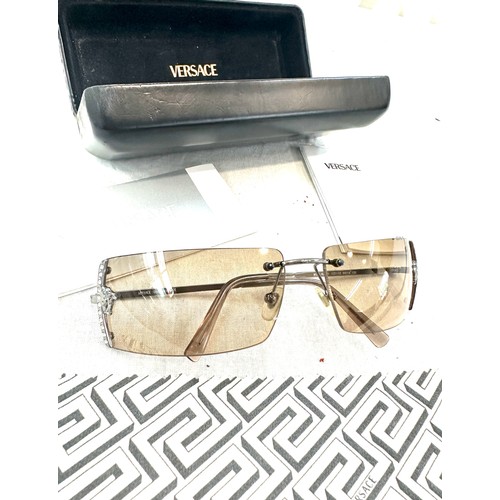 481 - Pair of boxed ladies Versace sunglasses and a DKNY wrist watch