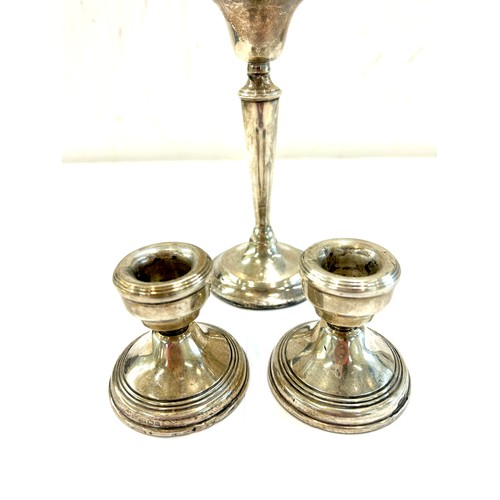 499 - Pair of hallmarked sterling silver candlesticks plus one other