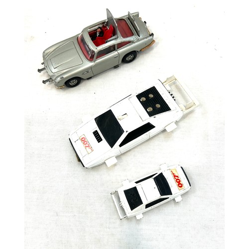 565 - Selection of three corgi 007 James Bond cars includes Aston Martin db5 etc