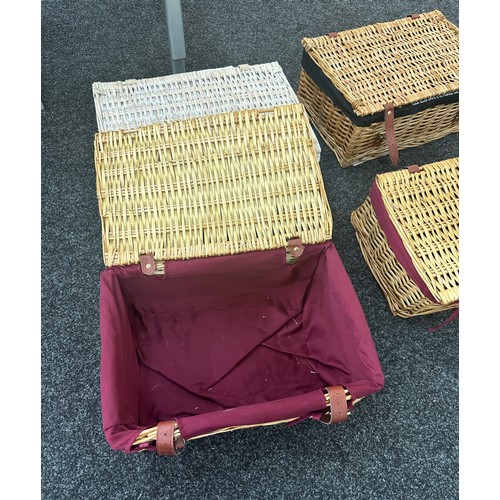 243 - Four vintage wicker picnic baskets largest measures approx 18 inches long by 12 inches deep and 8 in... 