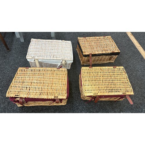 243 - Four vintage wicker picnic baskets largest measures approx 18 inches long by 12 inches deep and 8 in... 