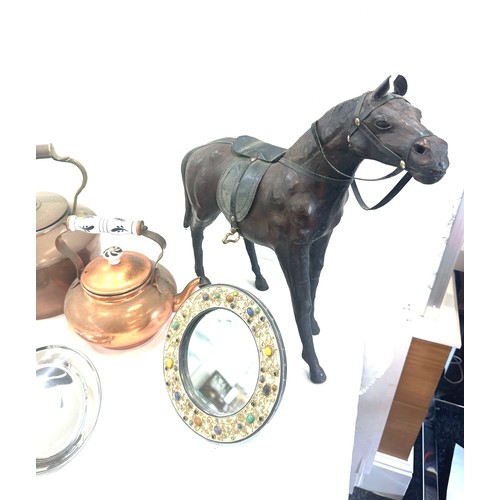 242 - Selection of collectable items to include two copper kettles, leather horse, some brass and EPNS