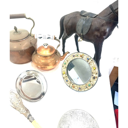 242 - Selection of collectable items to include two copper kettles, leather horse, some brass and EPNS