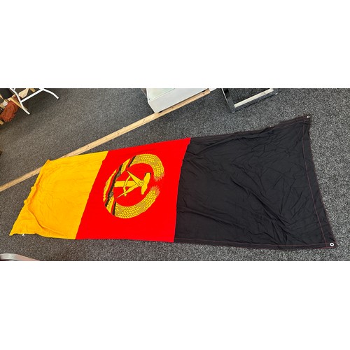 44 - Vintage East Germany flag measures approx 109 inches long by 38 inches wide