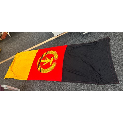 44 - Vintage East Germany flag measures approx 109 inches long by 38 inches wide