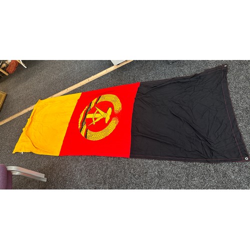 44 - Vintage East Germany flag measures approx 109 inches long by 38 inches wide