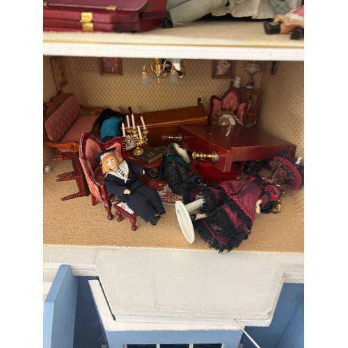 267 - Large dolls house with a large selection of vintage and later dolls house furniture, measures approx... 