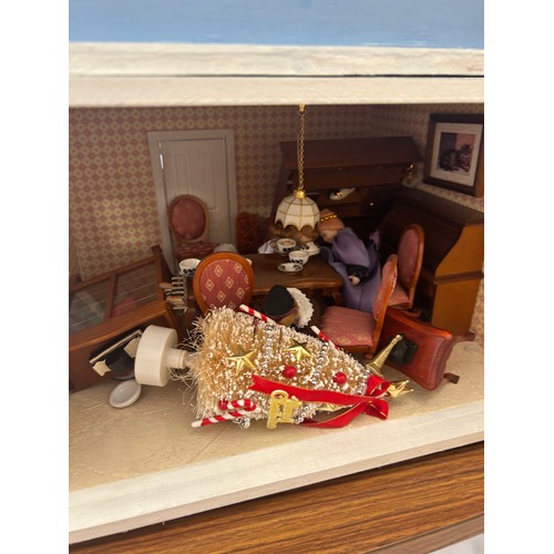 267 - Large dolls house with a large selection of vintage and later dolls house furniture, measures approx... 