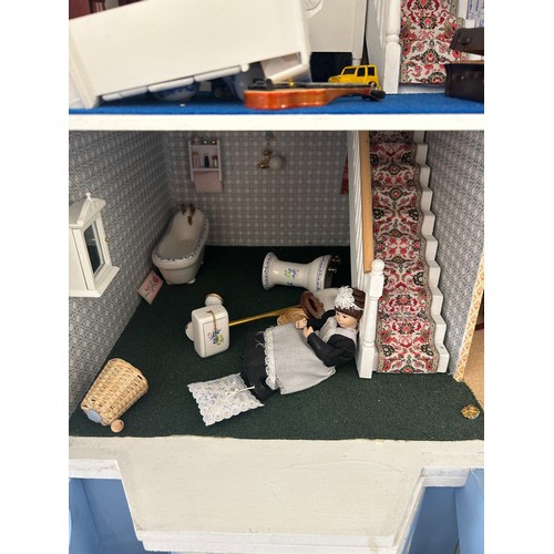 267 - Large dolls house with a large selection of vintage and later dolls house furniture, measures approx... 