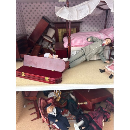 267 - Large dolls house with a large selection of vintage and later dolls house furniture, measures approx... 