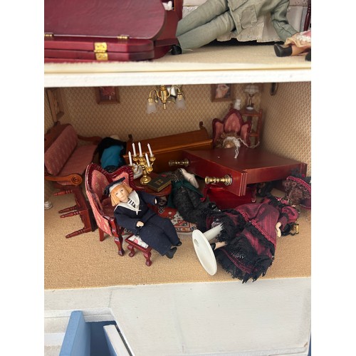 267 - Large dolls house with a large selection of vintage and later dolls house furniture, measures approx... 