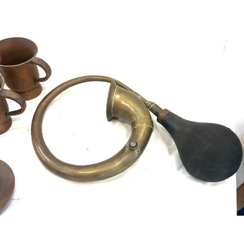 62 - Selection of vintage copper signed handled cups, a strainer and a brass horn